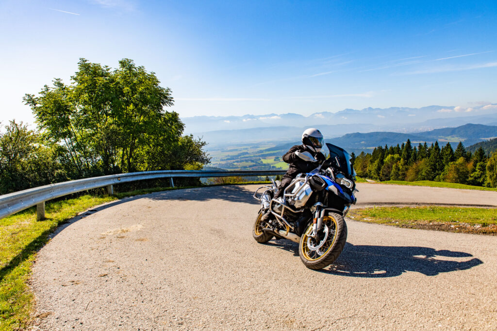 Motorcyclist on a touring enduro on a bend by the roadside
